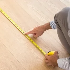 Man Measuring | Kelly's Carpet & Furniture